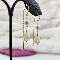 Enhance your  attire with our Pikake Earrings.  The elegant Jasmine floral design and the shimmering Mother of Pearl and South Sea Pearl accents will add a touch of sophistication to any look.  Handmade in Hawaii, these earrings are made with 14K Yellow Gold Fill for a lasting and luxurious finish. Features: Handcarved Mother of Pearl  Jasmine ( Pikake ) flowers Approx. 7mm x 10mm White South Sea Pearl: approx. 6mm Perfect for tropical vacation, Hawaiian jewelry, birthday gift, anniversary, moth Gold Pearl Flower Earrings For Wedding, Dainty Yellow Gold Flower Earrings For Wedding, Gold Pearl Drop Flower Earrings For Party, Gold Flower Earrings With Pearl Drop For Party, Dainty White Pearl Earrings For Party, Yellow Gold Flower Earrings For Wedding, Delicate Yellow Gold Flower Earrings For Wedding, Elegant White Flower Earrings For Celebration, White Dainty Bridal Earrings For Parties