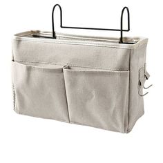 an over the door storage bag with two hanging pockets and one open pocket for storing items