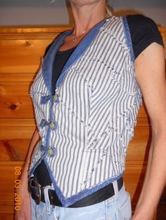 "The little pieces of fabric were joined into panel big enough to cut the vest. The edges of scraps are sewn out, so after washing on all seams appeared little fringes. Narrow shoulders , deep front V-neckline, big armholes, triangle shaped bottom of front gives a vintage look. Vest has shawl little collar on the front only. Vest has 3 buttons closure and is lined with acetate lining. Armholes, front and bottom are finished by navy jeans bias. It looks great with blue jeans , white shorts or wha Fitted Cotton Denim Vest With Patchwork, Fitted Cotton Patchwork Denim Vest, Fitted Patchwork Denim Vest, Narrow Shoulders, Jeans White, Vest Outfits, Navy Jeans, Navy Stripes, Shawl Collar