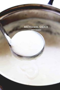 a spoon full of white sauce in a pot with the words bechamel sauce on it