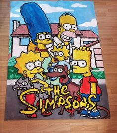 the simpsons family is depicted in this hand - drawn drawing on paper, which appears to be part of a children's art project