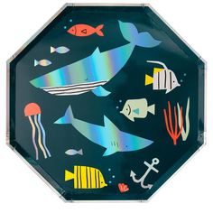 an image of a plate with fish and sea life on it's side,