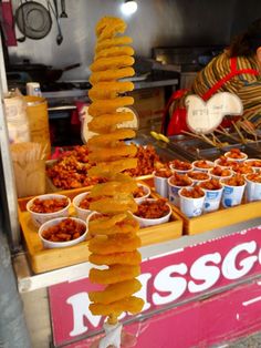 the food stand has many different kinds of snacks on it