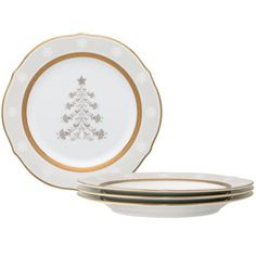 three white and gold plates with a christmas tree on the plate, one is empty