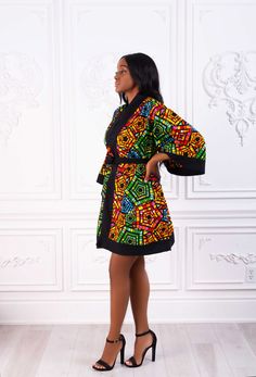 Beautiful African print Ankara Kimono dress. Bright and Bold colors. Bell Sleeves. Tapered with that luxe black Crepe. Short and can be worn with or without bottoms. This outfit depicts the complete Contemporary African look. Its an outfit for all occasions. Made with High quality 100% African Wax cotton Unlined Made in Nigeria CARE INSTRUCTIONS: Hand wash cold, DO NOT BLEACH, Hang dry, Press with cool iron on the wrong side only. Short Flare Gown Styles Crepe, Ankara Short Gown Styles 2023, Ankara Peplum Dress, Ankara Kimono Dress, Short Flare Gown Styles, Ankara Flared Dress, Short Flare Gown, Flare Gown Styles, Latest Ankara Gown Styles