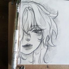 a pencil drawing of a woman's face with long hair and bangs, on top of a piece of paper