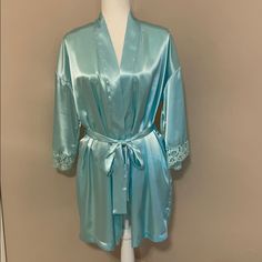 Victoria’s Secret Vintage Blue Satin Short Robe With Lace On End Of Sleeves; Has Satin Tie Belt That Goes Through Belt Loops On Outside; Has Two Inner Pockets; Has One Satin String On Inside Right That Ties To String On Outside Left; Nwot; Never Worn; Smoke Free Home. Blue Sleepwear For Wedding Night In Spring, Light Blue Sleepwear For Wedding Night In Spring, Victoria's Secret Blue Sleepwear With Lace Trim, Fitted Blue Victoria's Secret Sleepwear, Satin Short, Sleepwear Robe, Blue Satin, Tie Belt, Women's Intimates