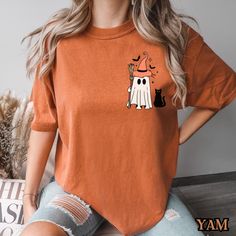 Get into the Halloween spirit with this adorable Witch Ghost T-Shirt! Featuring a cute ghost dressed in a witch hat, holding a broom, and accompanied by a pair of spooky eyes, this shirt is perfect for anyone who loves Halloween fun. The design is ideal for Halloween parties, trick-or-treating, or simply celebrating the spooky season. Whether you're a fan of cute ghost designs or looking for a fun, festive shirt to wear during fall, this tee is sure to bring a smile to your face. Made from soft, comfortable fabric, it's great for all-day wear. Grab this charming Halloween shirt and get ready for some spooky fun! 📝PLEASE CONFIRM📝 This is a standard unisex size Comfort Colors Tee. For an oversized tee, please size up. If you are looking for an oversized "T-shirt Dress" look, we recommend s Ghost Dresses, Cat Hacks, Oversized T Shirt Dress, Festival Shirts, Comfort Colors Tee, Fete Halloween, Halloween Ghosts, Spirit Halloween, Halloween Shirt