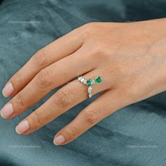 A dazzling touch of Zambian Emerald over the 18k White Gold base which adds up to the elegance of the ornament. An elegant Ring of adornment that would definitely grab attention! ✧✧Welcome To Our Shop Spectrum Jewels India✧✧ ""18k White Gold Zambian Emerald Ring For Women, Natural Diamond Statement Ring For Birthday Gift, Valentine Ring Jewelry For Wife"" ★PRODUCT SPECIFICATION★ * ITEM CODE - SER-22631 * METAL - 18k White Gold * 18k White Gold Weight : 3.12 gm  * GROSS WEIGHT - 3.42 gm Approx * Birthday Diamond Ring In Fine Jewelry Style, Fine Jewelry Diamond Ring For Birthday, Brilliant Cut Birthstone Ring For May, May Birthstone Ring With Brilliant Cut For Gift, Brilliant Cut Diamond Anniversary Ring For May Birthstone, Elegant Rings With Diamond Accents For Birthday, May Birthstone Ring With Brilliant Cut As A Gift, Birthday Fine Jewelry Diamond Ring, Elegant Diamond Birthday Rings