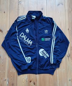 Stylish sport track top by Adidas. High quality and classic design, two side pockets and embroidered logo. Jacket is in great condition except for some occasional spools. Measurements; back-76cm, sleeve from neck-76cm, width pit to pit-64cm. Size L. Adidas Track Top, Adidas High, Australian Vintage, Sports Track, Adidas Design, Adidas Vintage, Adidas Football, Sport Top, Adidas Track