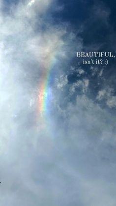 a rainbow in the sky with a quote above it that reads beautiful, isn't it?