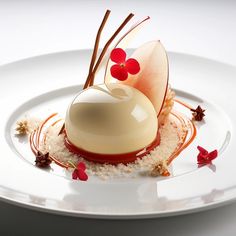 a white plate topped with a dessert covered in icing and garnishes