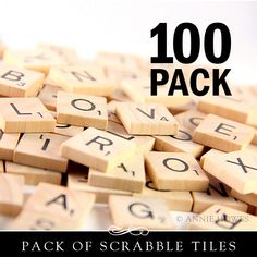 a pile of scrabble tiles with the words 100 pack written on them in black and white