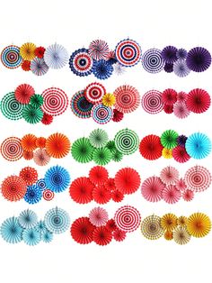 an assortment of different colored paper fans