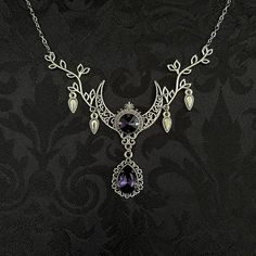 "This enchanting moon elf necklace features richly detailed antiqued silver tone filigree crescent, intricate leafy branches and elegant scroll drop accents. Its captivating design is adorned with dazzling dark amethyst purple glass crystals. Decorated portion is 4 1/2\" wide and 2 1/2\" tall in the very center.  Necklace length is adjustable with soldered stainless steel cable chain, lobster clasp and extender. If you would like a different length, please send us a message. Matching headpiece, pendant and earrings are listed separately in our store. If you don't see items with a color you want, feel free to ask about availability." Crescent Moon Phase Necklace For Wedding, Fantasy Silver Jewelry With Moon Charm, Mystical Crescent Jewelry For Wedding, Mystical Silver Jewelry With Intricate Design, Gothic Silver Crescent Necklace, Gothic Crescent Silver Necklace, Silver Crescent Filigree Jewelry, Elf Necklace, Purple Crescent Moon