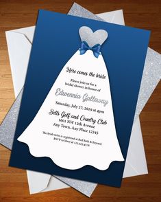 a blue and white bridal gown birthday party card on top of two envelopes