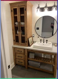 a bathroom with a sink, mirror and wooden cabinets