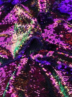 a purple and green sequinized fabric