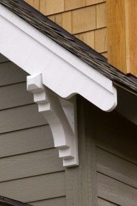 the corner of a house with a white gutter