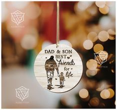 a wooden ornament with an image of a man and his dog that says, dad & son best friends for life