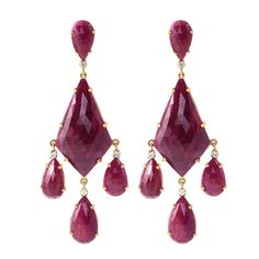 18 Karat Yellow Gold 59.98 Carat Ruby and Diamond Cocktail Dangle Earrings This magnificent scarlet red and diamond long slice hanging earring is phenomenal. The solitaire long kite shaped faceted slice ruby in 6-grain prong setting in the center is the highlight of the earring that’s further amplified with pear shaped faceted slice ruby branching out from the three sides with the double round loop and prong set round diamond solitaire giving the perfect flexibility and movement for the pear dro Hanging Earring, Turquoise Drop Earrings, Turquoise Earrings Dangle, Diamond Dangle Earrings, Ruby Earrings, Hanging Earrings, Yellow Gold Earring, Diamond Drop Earrings, Gold Earrings Dangle