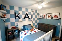 a child's bedroom with blue and white checkered walls