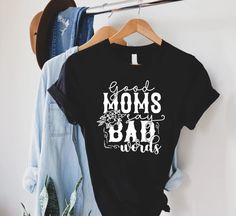 Good Moms Say Bad Words Shirt,Funny Mom Quotes Shirt,Mom Life Tshirt,Funny Mom Shirt,Mothers Day,Motherhood Shirt,Trendy Mom Shirt,Good Moms ----- How To Order ----- 1-) Please, check and review all the photos. 2-) Choose your t-shirt size and color. *Different styles of shirts may have different shades of same color choice due to different manufacturer brands. *For this reason, we recommend you to match shirts from the same styles if you want precisely matching colors (ex. Unisex, V-necks, Todd Funny Cotton T-shirt With Lettering, Good Moms Say Bad Words, Motherhood Shirts, Bad Words, Quotes Shirt, Word Shirts, Funny Mom Shirt, Funny Mom Quotes, Trendy Mom