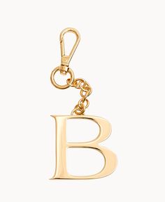 Personalize It    Customize your handbag, keychain, and more with a monogram charm made from jewelry-grade hardware with a special 24k gold coating that protects from signs of wear. Luxury Gold Bag Charm As Gift, Gold Keychain Bag Charm For Everyday Use, Gold Jewelry With Metal Logo For Gifts, Gold Jewelry With Metal Logo As A Gift, Gold Keychains With Lobster Clasp For Everyday Use, Gold Bag Charm With Logo For Everyday Use, Gold Bag Charm With Logo, Luxury Keychain With Key Clip For Gift, Luxury Keychain With Key Clip As Gift