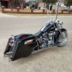 a black motorcycle is parked on the street