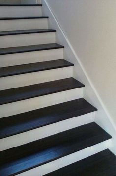 black and white stairs leading up to a door