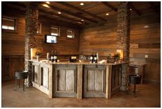 a rustic kitchen with stone and wood accents