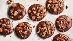 chocolate cookies with pecans and nuts on top