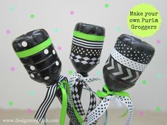 three black and white vases with polka dots on them, tied to each other