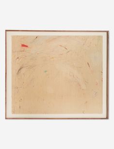 an abstract painting with red and green paint on white paper in a brown wooden frame