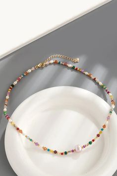 Multicolored Bead Necklace Elevate your style with the exquisite Multicolored Bead Necklace, a perfect blend of elegance and vibrancy. This stunning piece of jewelry combines bead, crystal, and freshwater pearl elements to create a versatile accessory that complements any outfit, from casual wear to evening attire. Key Features: Material: High-quality bead, crystal, and freshwater pearl. Chain Length: 16.5 inches with an additional 2.4-inch extension chain for adjustable fit. Weight: Lightweight Multicolor Pearl Jewelry With Faceted Beads, Multicolor Pearl Beaded Necklace With Pearl Chain, Multicolor Pearl Necklace With Beaded Chain, Multicolor Pearl Necklace With Colorful Beads, Multicolor Pearl Beaded Jewelry, Multicolor Beaded Pearl Jewelry, Beaded Pearl Crystal Necklace With Round Beads, Pearl Beaded Crystal Necklace With Round Beads, Pearl Beaded Crystal Necklace