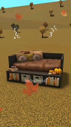 a couch sitting in the middle of a field with autumn leaves on it and an orange maple leaf