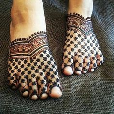 the feet are decorated with black and white designs