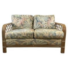 an image of a couch that is in the style of bamboo and has flowers on it