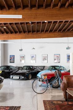 a garage filled with lots of cars and furniture