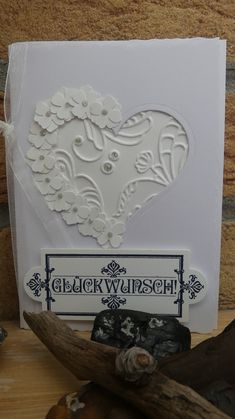 a white card with a heart on it