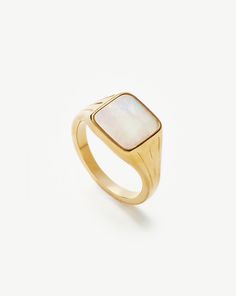 Lucy Williams Square Signet Ring | 18ct Gold Plated Vermeil/Mother of Pearl. A Vintage-Inspired Take on the Classic Signet Ring, this Mother of Pearl Gemstone is Believed to Attract Abundance and Prosperity. Style this Signature Piece Solo, Wear It on Your Pinky, or Stack with More Delicate Styles. Metal: 18Ct Recycled Gold Plated Vermeil on Recycled Sterling Silver Gemstone: Mother of Pearl Band Width: 1. 8mm Stone Dimensions: 11mm Weight: 5. 3g Product Code: Lws-G-R6-Mop Luxury 14k Gold Opal Ring, Modern 14k Yellow Gold Moonstone Ring, Luxury Polished Moonstone Ring, Luxury White Signet Ring With Polished Finish, Luxury Gold Opal Ring, Luxury White Moonstone Promise Ring, Timeless Gold Polished Moonstone Ring, Luxury Yellow Gold Opal Ring With Polished Finish, Classic Yellow Gold Moonstone Ring With Polished Finish