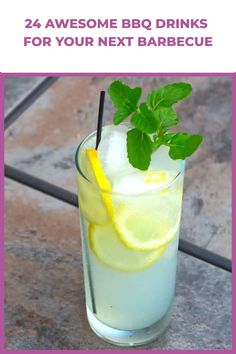 a glass filled with lemonade and mint on top of a tile floor next to a pink frame