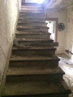 an old set of stairs leading up to a window