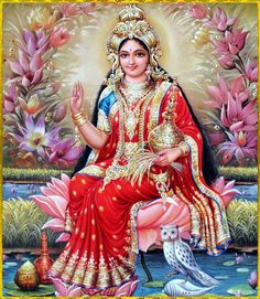 the hindu goddess sitting in front of flowers