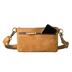 This light tan colored leather belt bag is showing the front view Leather Shoulder Bag With Waxed Finish For On-the-go, Vegetable Tanned Leather Rectangular Shoulder Bag For Everyday Carry, Rectangular Leather Saddle Bag For Everyday Carry, Leather Crossbody Camera Bag With Leather Lining, On-the-go Waxed Leather Shoulder Bag, Leather Crossbody Belt Bag For Everyday, Functional Leather Bag With Waxed Finish, Functional Leather Bags With Waxed Finish, Everyday Leather Belt Bag With Smooth Grain