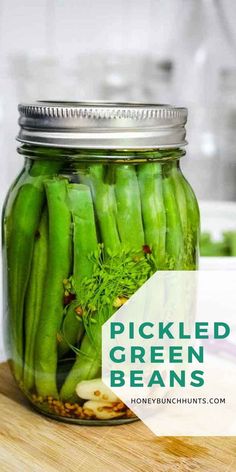 pickled green beans in a mason jar with text overlay