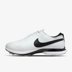 the nike air zoom golf shoe is white with black and silver accents on the upper part