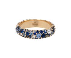 With its combination of cool toned color and subtle sparkle, this Renna ring packs a punch with its combination of stones. The 18K yellow gold band is set with a surface of round, white diamonds surrounded by blue sapphires varying in tone from sky blue to deep sea. This ring will be like a tiny tidepool shimmering on your finger.sapphires : vary : 1mm diameter to 2mm diameter each : 2.00cttwdiamonds : vary : 1.5mm diameter to 2.5mm diameter each : .40cttw18K yellow gold band width : 5mm availab خواتم خطوبة, Colorful Ring, Blue Ring, Designer Fashion Jewelry, Fine Jewelry Designers