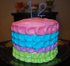 a colorful cake with the number twelve on it