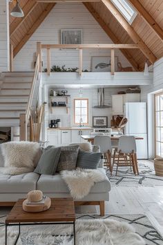 a living room filled with furniture next to a staircase